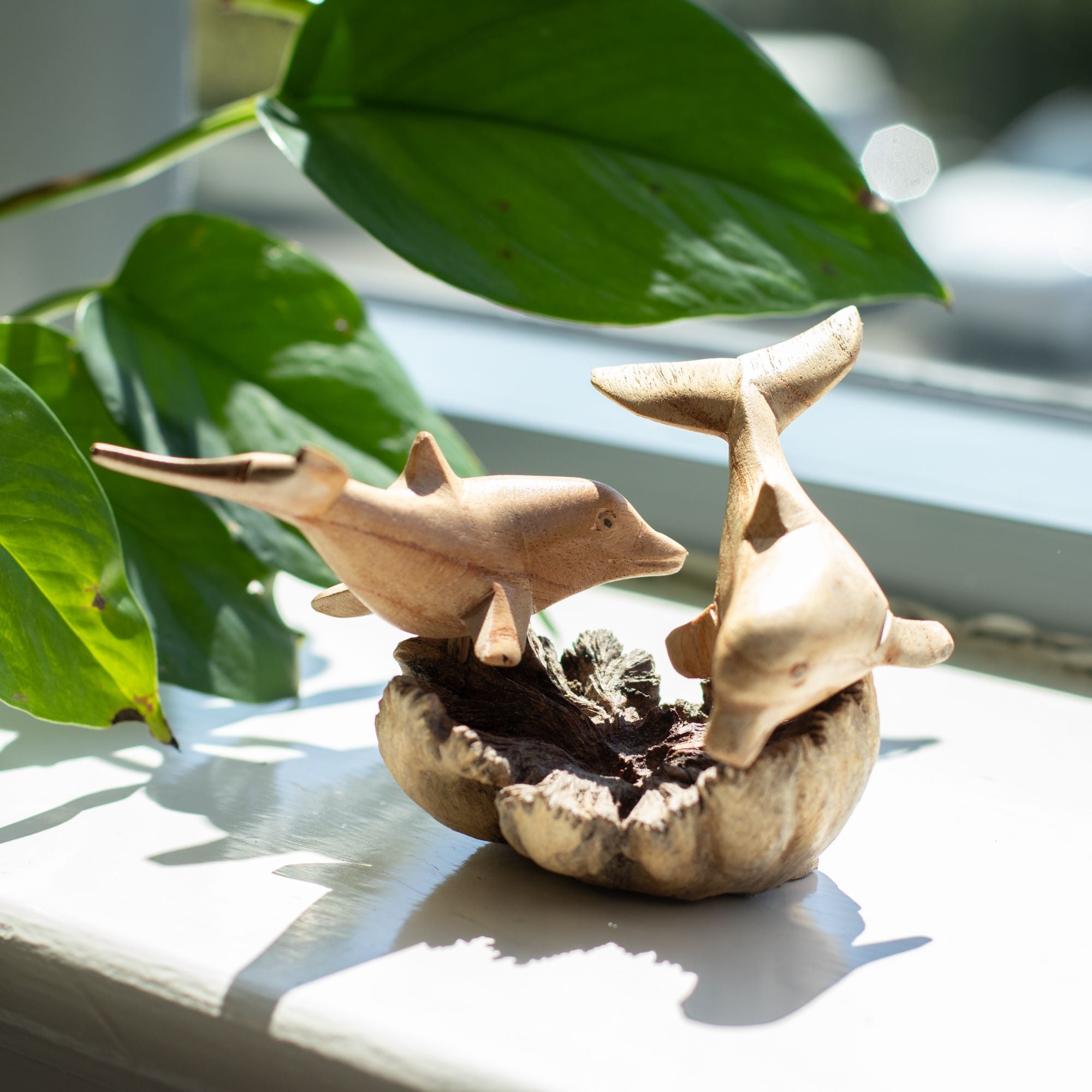 Hand-Carved Parasite Wood Playing Dolphins Sculpture – product view